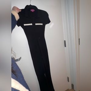 Edikted black pant jumpsuit with white pocket detailing. Size xs, flare bottom